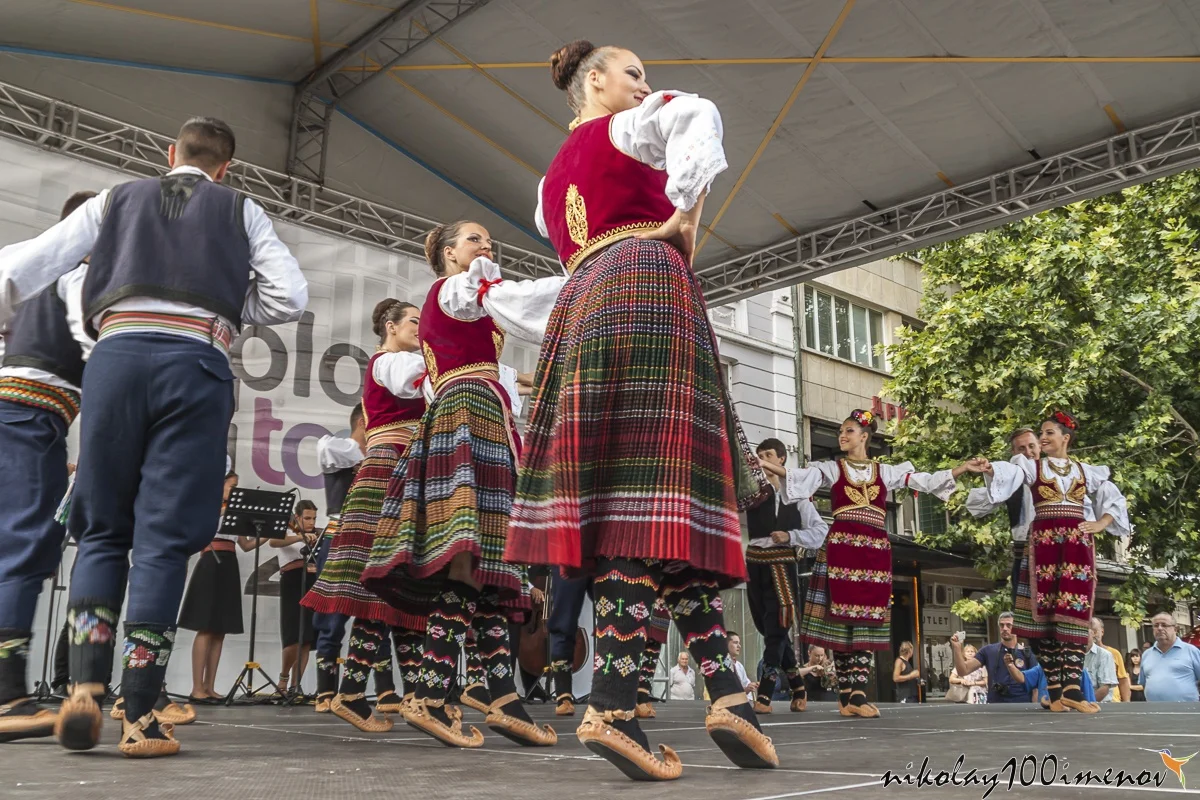 PLOVDIV, BULGARIA - AUGUST 06, 2015 - 21-st international folklore festival in Plovdiv, Bulgaria. The folklore group from Serbia dressed in traditional clothing is preforming Serbian national dances.